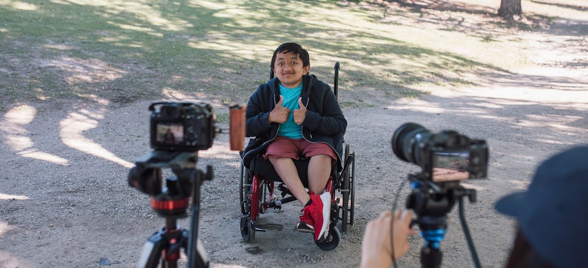 Canuck Place child being interviewed outdoors while enjoying recreation therapy activities at Canuck Place Children's Hospice