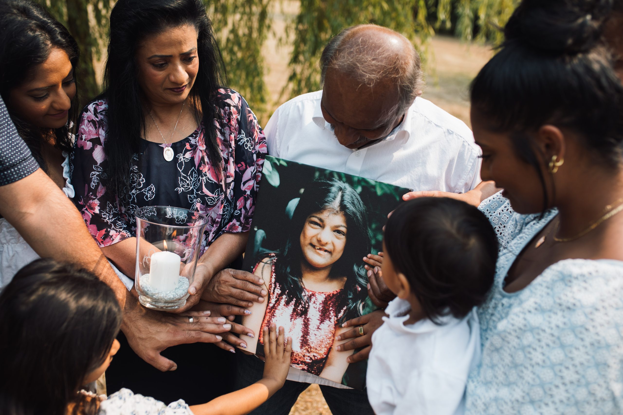 The Premia Family with a photo of Angelina